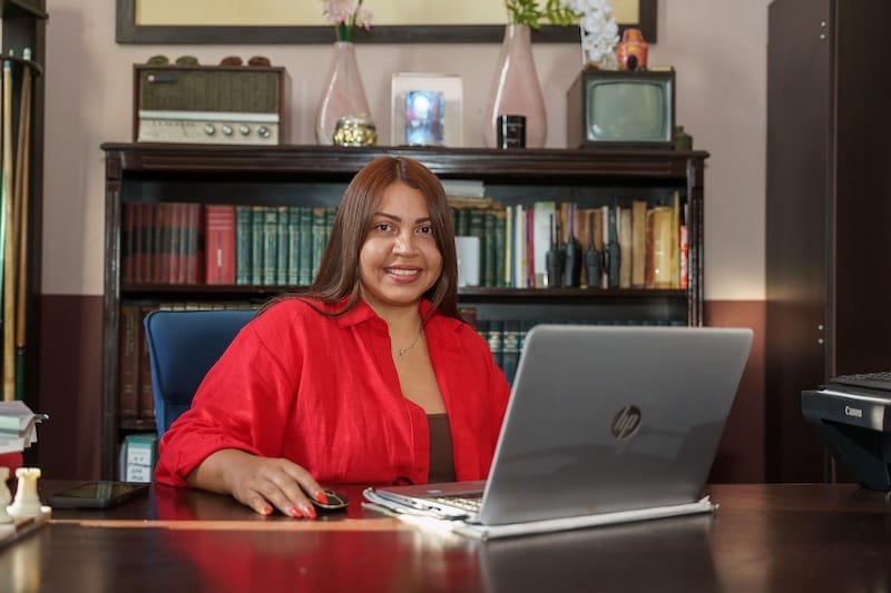 woman at laptop smiling