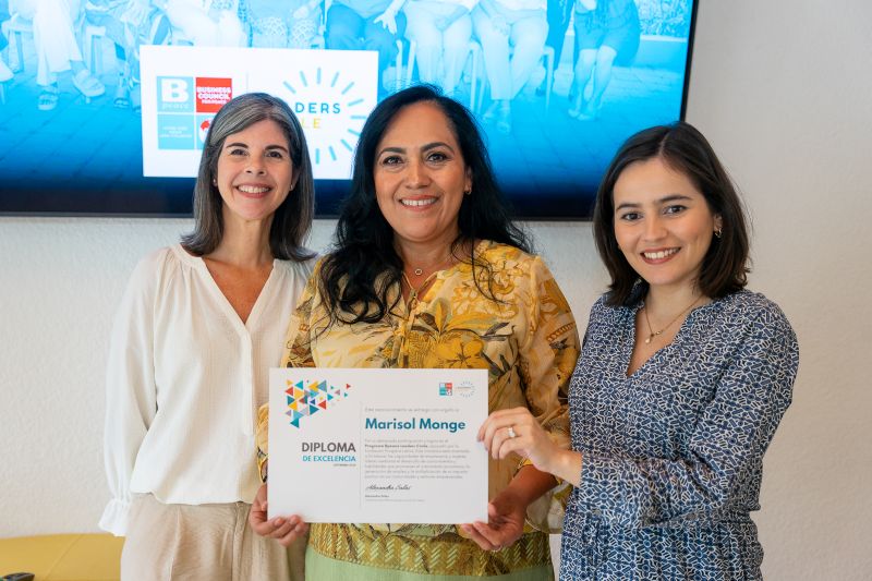 Marisol holding a diploma of excellence